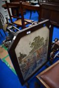 An early 20th Century embroidered fire screen