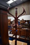 A traditional stained frame bentwood coat stand