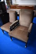 A pair of Victorian mahogany easy chairs 'ladies and gents' with later dralon upholstery