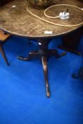A 19th Century oak low pedestal table having circular top