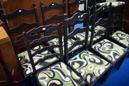 A Harlequin set of 9 ladder back dining chairs , with vintage style paint and upholstery