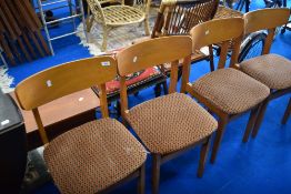 A set of four vintage dining chairs