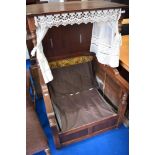 A vintage Sedan style oak chair, upholstery removed to comply with fire regulations