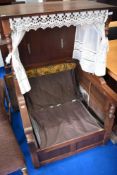 A vintage Sedan style oak chair, upholstery removed to comply with fire regulations