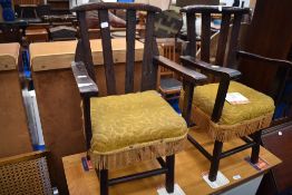 A pair of early 20th Century stained frame childrens chairs