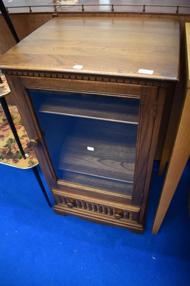 A modern dark Ercol hifi cabinet