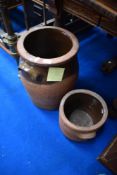 Two earthenware and part glazed crock pots