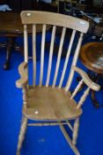 A traditional beech rocking chair