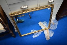 A gilt frame wall mirror