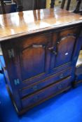 A nice quality oak TV cabinet, probably Titchmarsh and Goodwin
