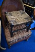 A Lloyd Loom nursing chair and a traditional footstool