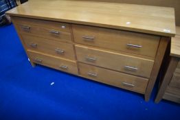 A modern beech narrow chest of six bedroom drawers