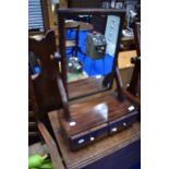 A Victorian mahogany toilet mirror with drawer base