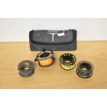 A Scierra fly reel with 3 spare spools in one original carry case