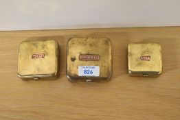A set of 3 graduated brass tins Marked 'MAGGOTS , WORMS, & BAIT' on copper applique