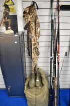 A pair of prologic max 4 waders size large boot size 9. A pro climate camoflage suit of jacket and