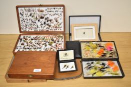 A large collection of boxed salmon and trout flies in large boxes, pocket boxes and wallet