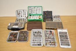 A large selection of mostly trout fishing flies in 8 boxes and a leather cast wallet