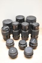 Nine SMC Pentax lenses, three M Zoom 1:4 75-150mm, a M Zoom 1:2,8-3,5 35-70mm, an A 1:1,7 50mm, an A