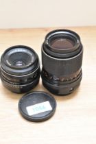 A Carl Zeiss Jena Tessor 2,8 50mm lens and a Carl Zeiss jena MC S 1:3,5 135mm lens