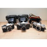 Three Praktica cameras. A Praktica Super TL body, a Praktica TL2 with Pentacon 1,8/50 lens and a