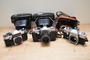 Three Praktica cameras. A Praktica Super TL body, a Praktica TL2 with Pentacon 1,8/50 lens and a