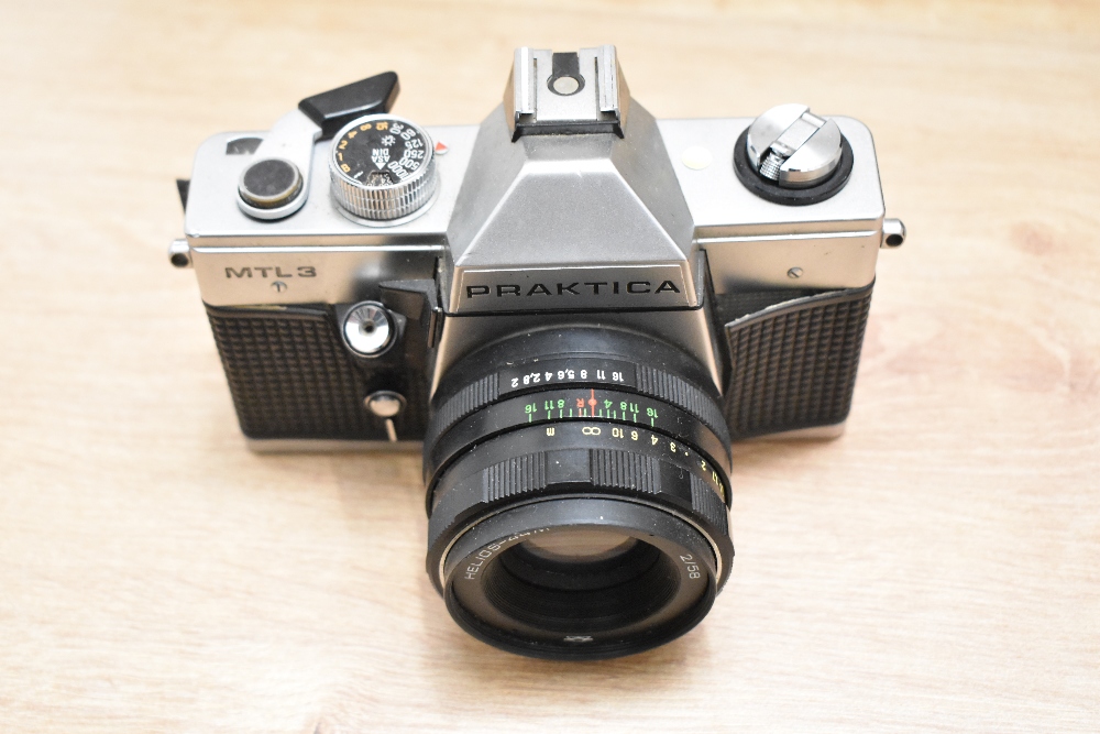 Three cameras and lenses. A Zenit EM Moshva 80 Olympic with Carl Zeiss Jana Tessar 2,8/50 lens, A - Image 3 of 6