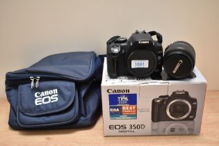 A boxed Canon EOS 350D digital camera with a Canon Zoom EF-S 18-55mm 1:3,5-5,6 II lens boxed with