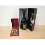 A bottle of Don Perignon Champagne Vintage 2000 750ml 12.5% vol in display box along with a Crug