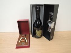 A bottle of Don Perignon Champagne Vintage 2000 750ml 12.5% vol in display box along with a Crug