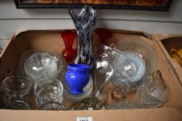 A selection of cut and pressed glass items including two different desert sets, sundae dishes and