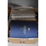 A box of maritime themed books and publications, including 'The Art of Nautical Illustration', '