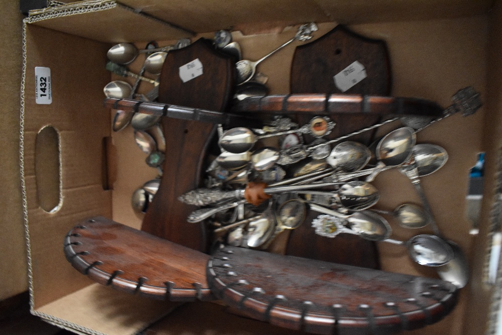A collection of assorted teaspoons and two display shelves. Also included are three hallmarked