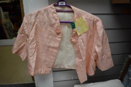 A 1940s pale pink bed jacket, believed to lined in WW2 parachute silk.