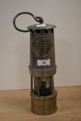 A mid-20th Century Hailwood & Ackroyd steel/brass miner's lamp, Type 01, measuring 30cm tall