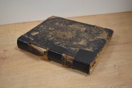 A leather bound antiquarian book, 'The English Physician Enlarged' by Culpeper.