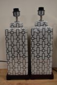 Two large modern ceramic table lamps, having silver gilt geometric style pattern.