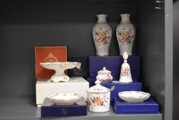 A collection of Royal Crown Derby and Royal Doulton floral ceramics, including vases, compote jar,
