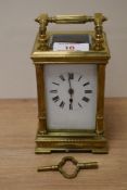 A French brass five glass carriage clock, having Roman numerals to face, with key.