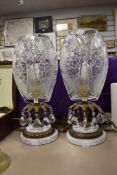 Two Victorian style Cut glass table lamps, having lustre's to moulded brass stems.