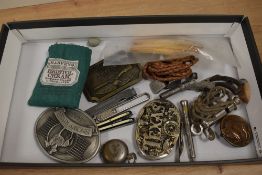 Thee vintage style metal belt buckles, a metal coin holder, A whistle (the metropolitan) and other