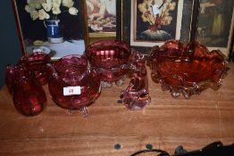 A selection of cranberry glass, including bowls and jug, also included is a pink glass cat