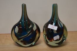 Two unusual Mdina glass bud vases, in mottled brown, blue and white tones.
