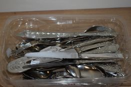 A collection of cutlery, having moulded handles.