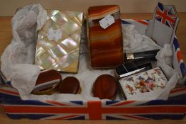 A collection of polished agate pill boxes and cigarette cases, including mother of pearl