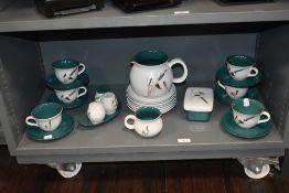 A collection of Denby tableware, having white ground with green interior and wheat sprig pattern