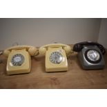 Three vintage bakelite telephones in cream and grey