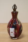 A multi coloured glass perfume bottle or similar, ill fitting lid, possibly a later addition.