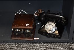 A vintage mid century rotary dial telephone and a set of telephone extension bells in wooden case.