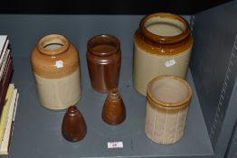 An assorted collection of stoneware jars, to include two conical shaped ink wells